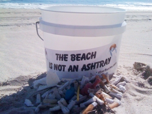 litter bucket with sticker, "the beach is not an ashtray"
